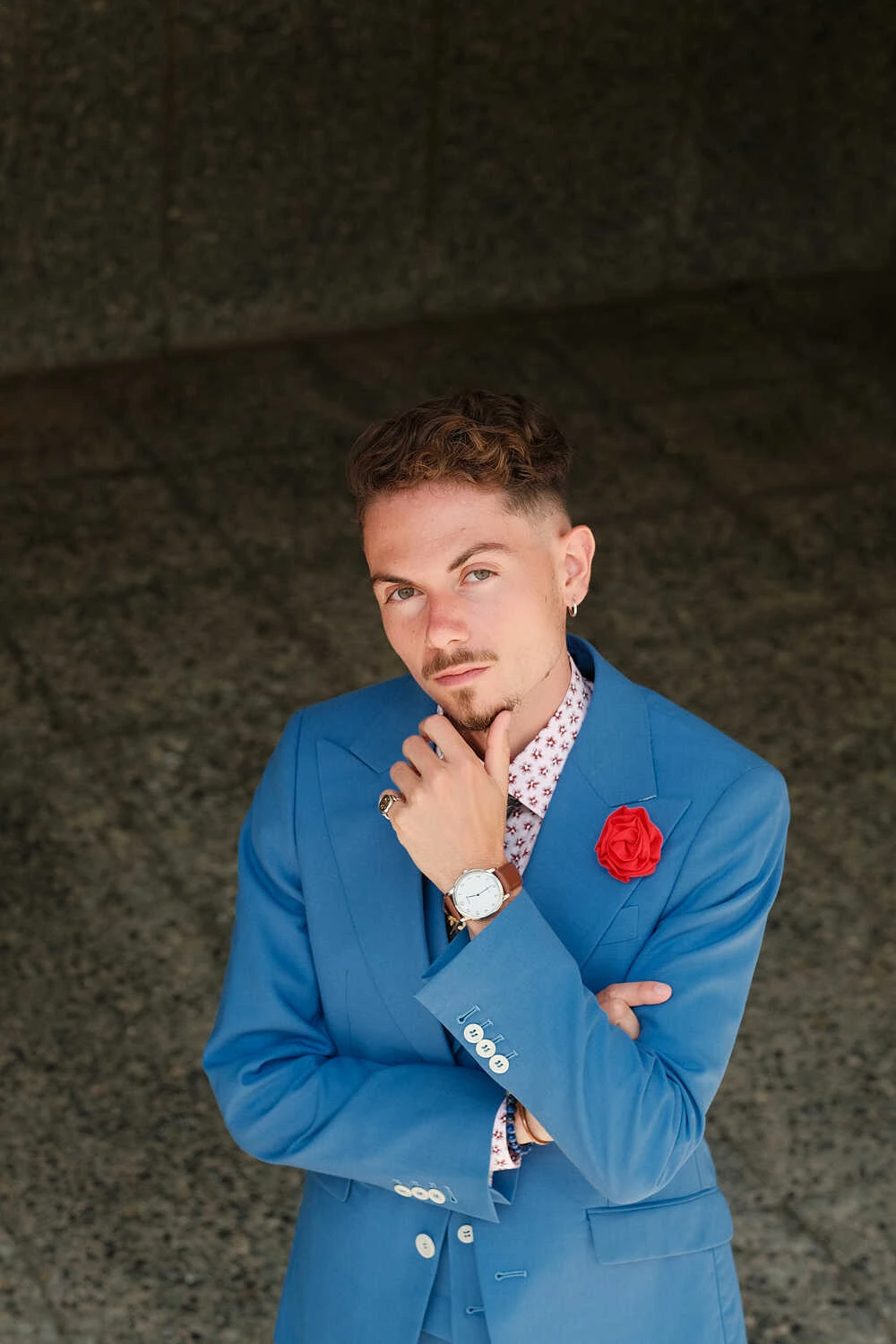 Model in a blue suit in a thoughtful pose for Hockerty in Florence
