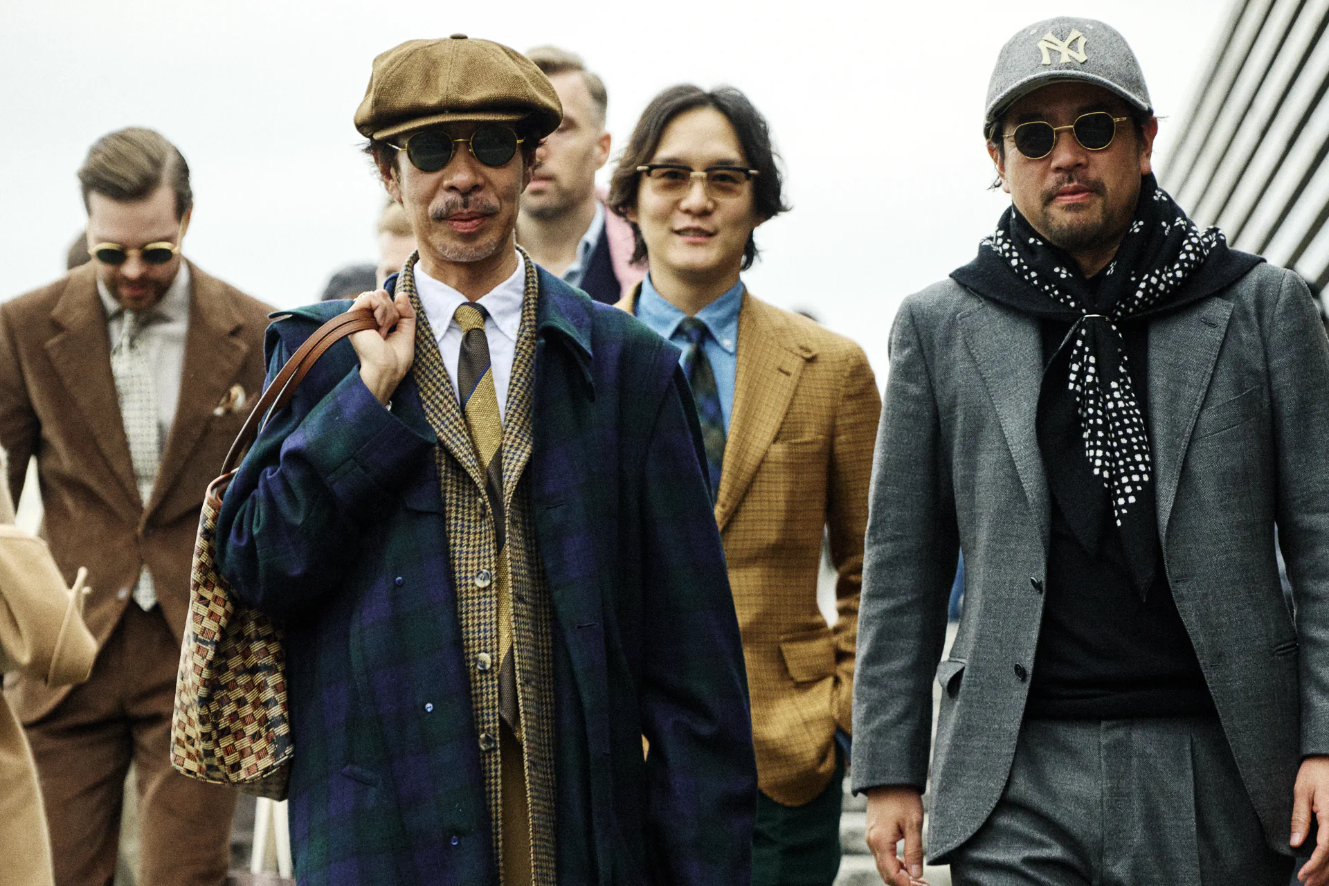 Group of stylish attendees descending the steps at Fortezza da Basso during Pitti Immagine Uomo 109, Florence xe2x80x94 cover image