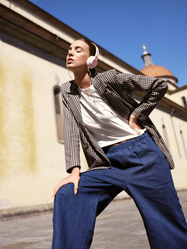 Street style portrait crossing a Florence piazza -- lifestyle fashion photography in Florence