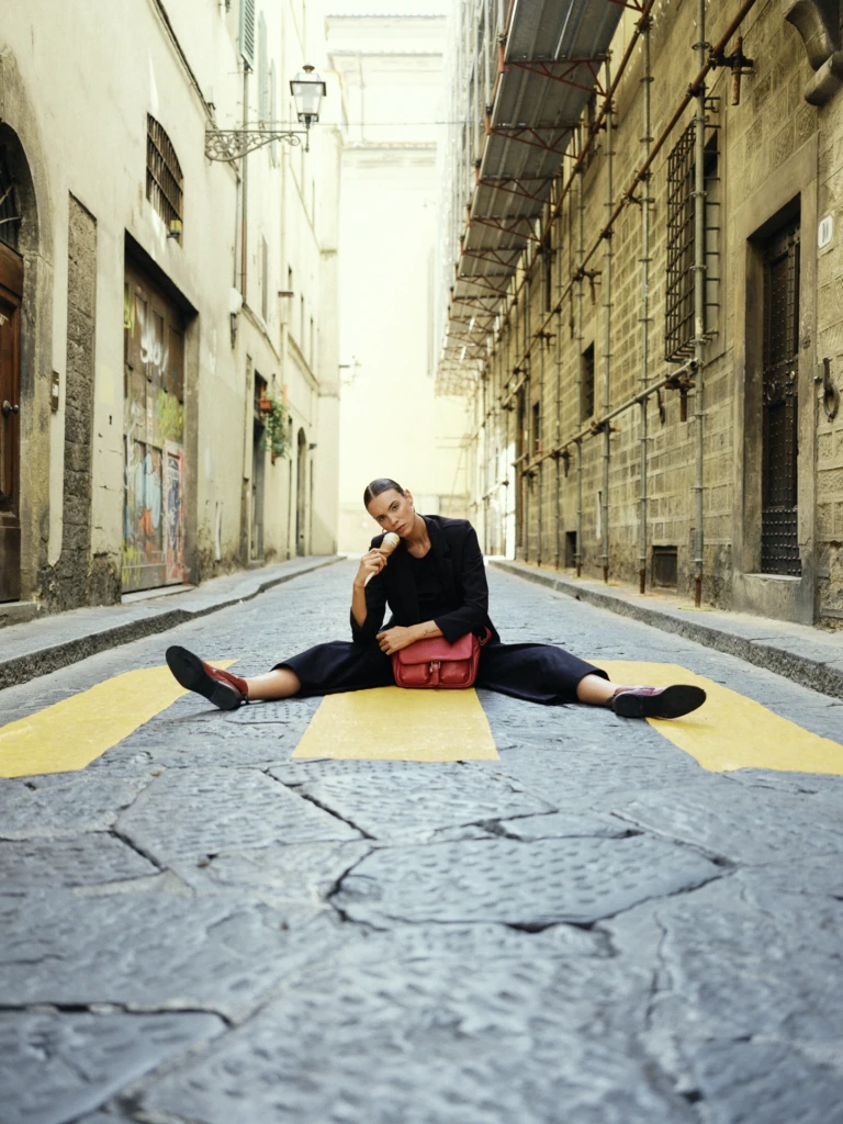 Model portrait framed by Florentine architecture -- Florence fashion lifestyle photography
