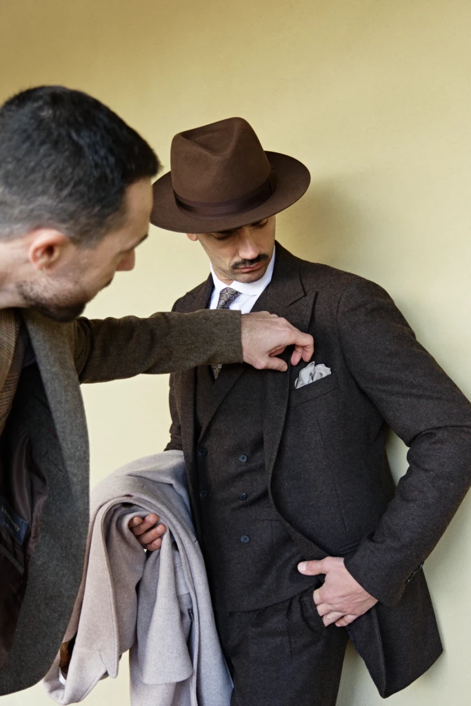 Hockerty menswear editorial photographed by Alessandro Michelazzi at Pitti Immagine Uomo 107 in the streets and pavilions of Florence, look 046.