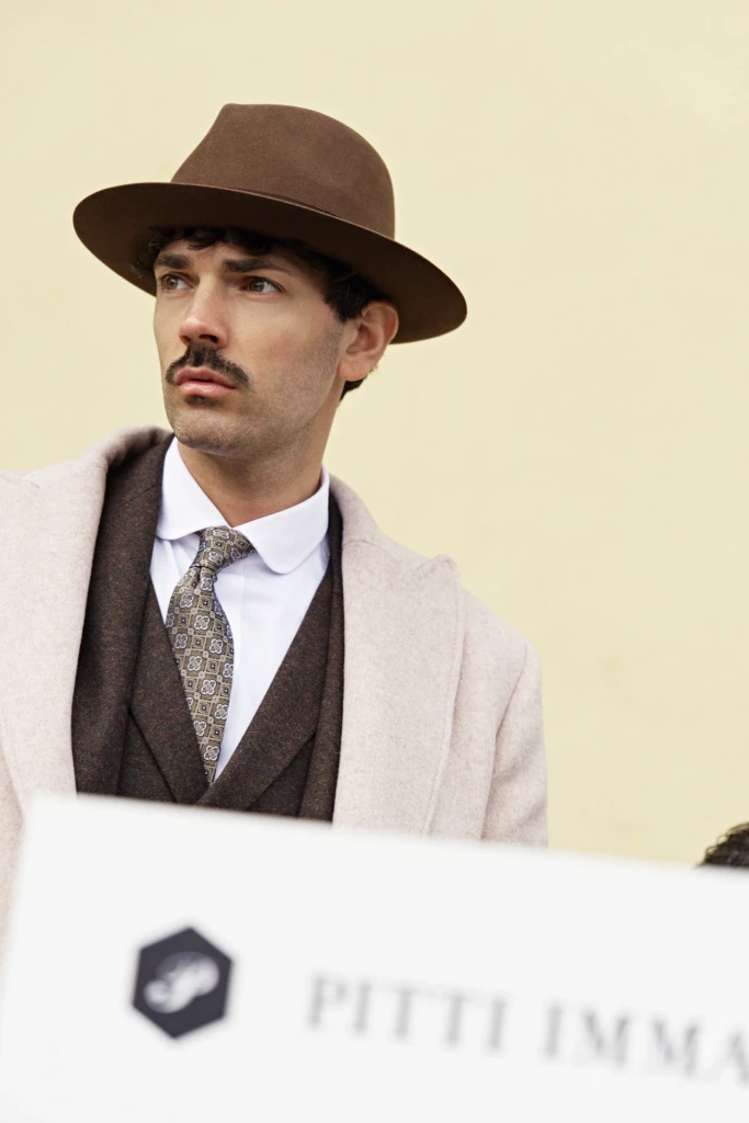 Hockerty menswear editorial photographed by Alessandro Michelazzi at Pitti Immagine Uomo 107 in the streets and pavilions of Florence, look 047.