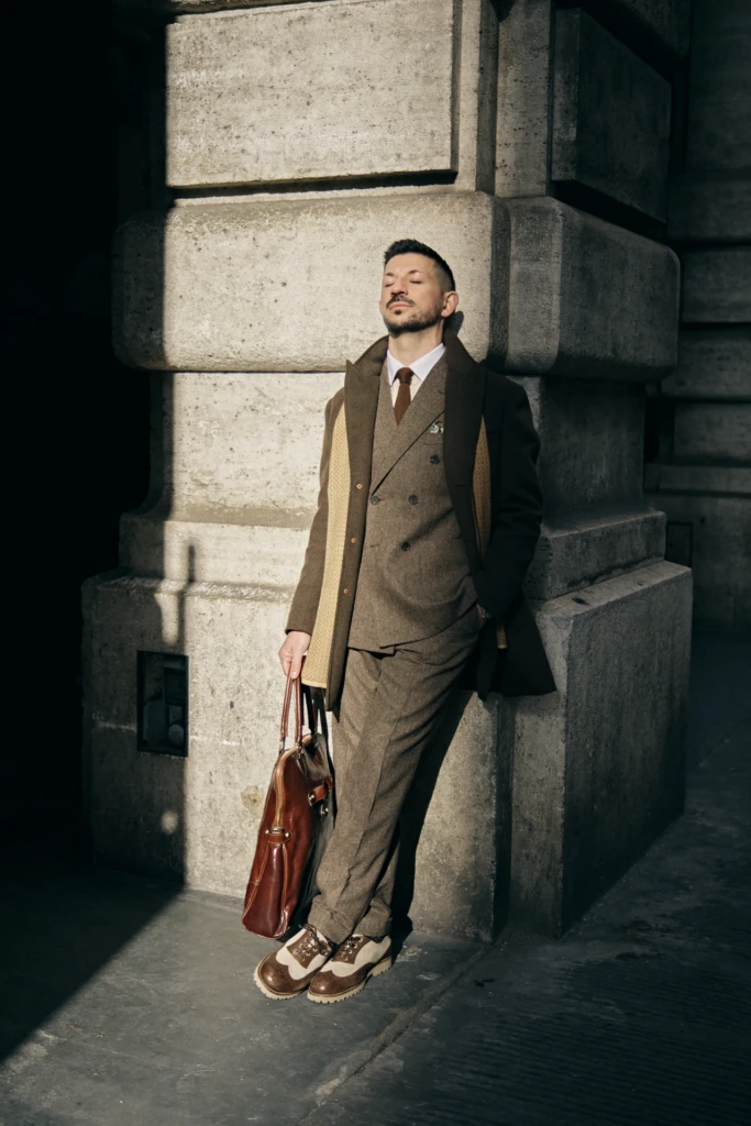 Hockerty menswear editorial photographed by Alessandro Michelazzi at Pitti Immagine Uomo 107 in the streets and pavilions of Florence, look 050.