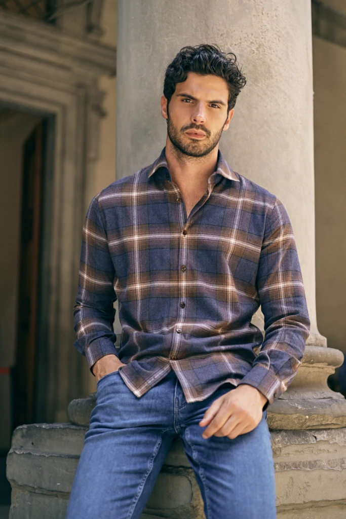 Patrick Assaraf campaign portrait against classic Florentine architecture -- fashion campaign photography by Alessandro Michelazzi