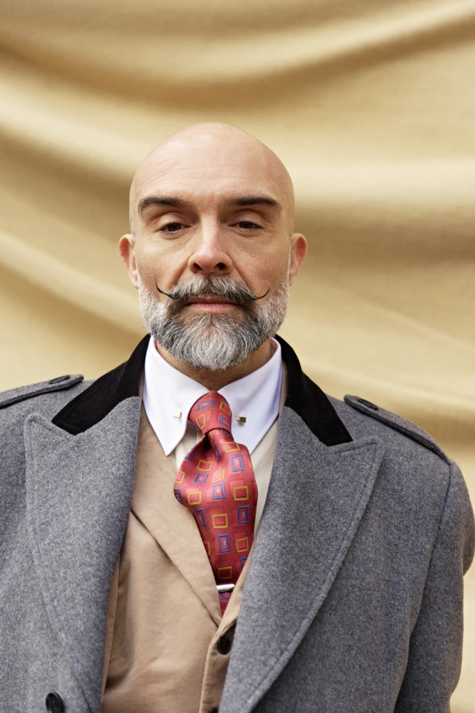 Hockerty menswear editorial photographed by Alessandro Michelazzi at Pitti Immagine Uomo 107 in the streets and pavilions of Florence, look 064.