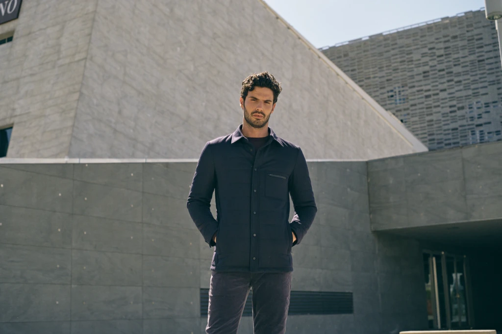 Patrick Assaraf campaign portrait against classic Florentine architecture -- fashion campaign photography by Alessandro Michelazzi