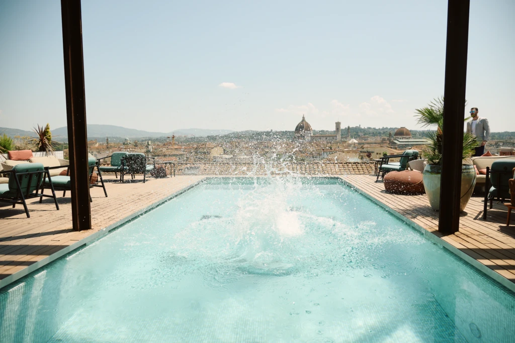 Hockerty Summer Lookbook rooftop party at the Student Hotel Florence, with the Duomo in view.