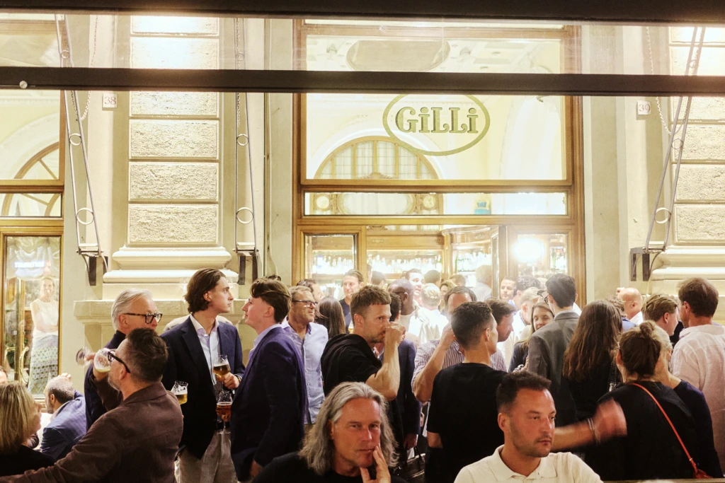 Guests at Gilli Caffè, a Pitti Uomo evening meeting point in Florence.