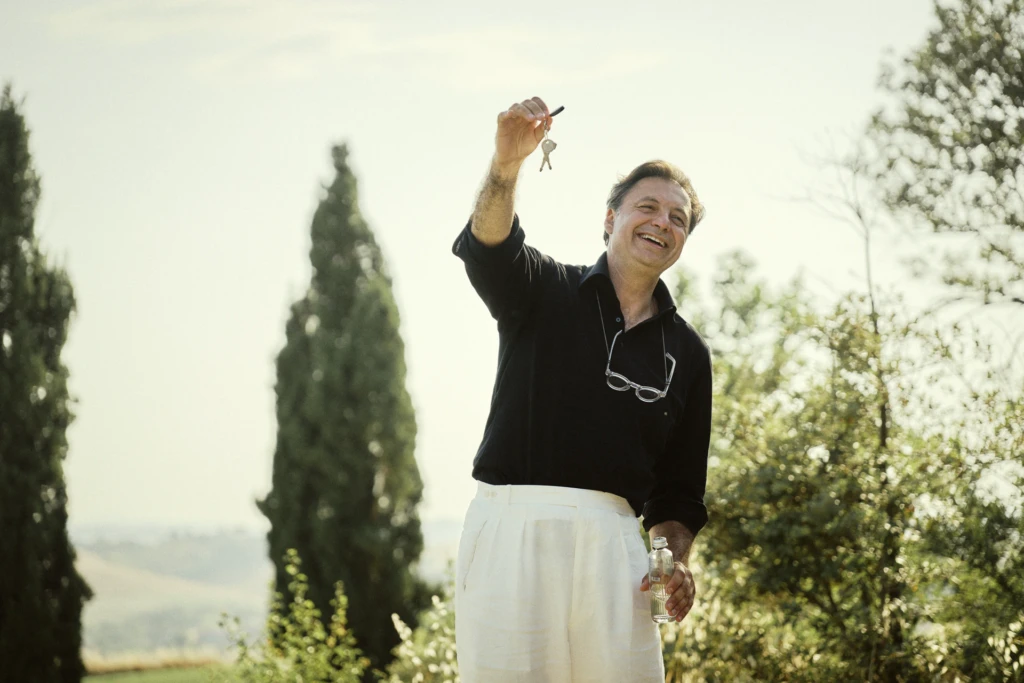 Guests enjoying the Tuscan countryside view at the NoChaser event, Tenuta d'Arbia.