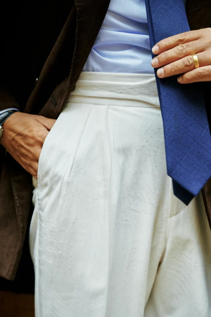 Detail of a tailored outfit with blue tie during the Sartorial 55 shoot, Pitti Immagine Uomo 109