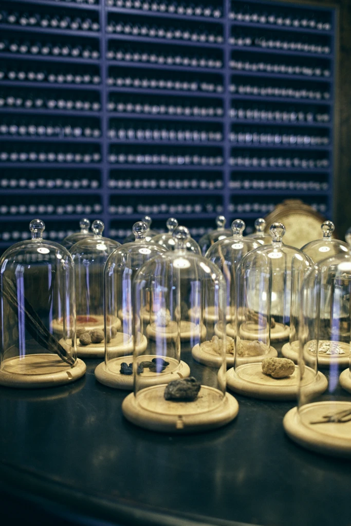Master perfumer measuring ingredients in Florence perfume workshop