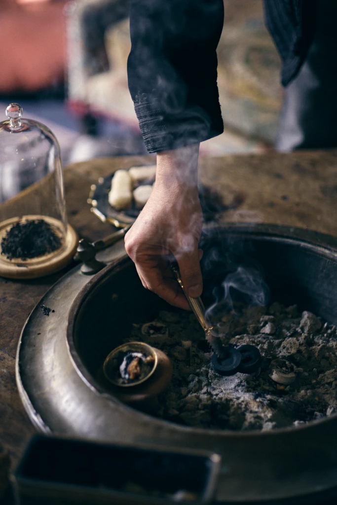 Sileno Cheloni smelling a freshly blended fragrance, Florence atelier