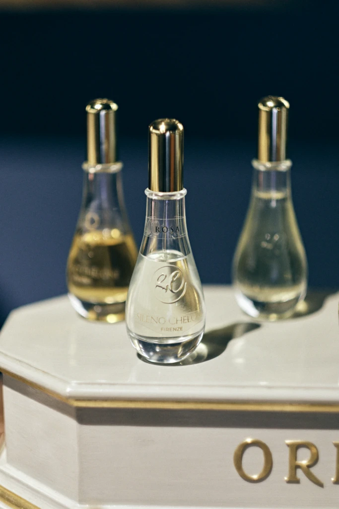 Sileno Cheloni portrait beside antique perfume scales, Florence