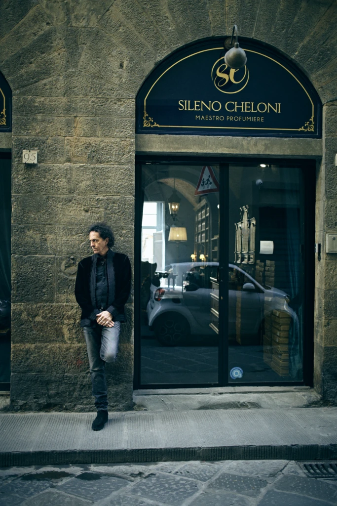 Master perfumer hands mixing a bespoke scent, Florence atelier